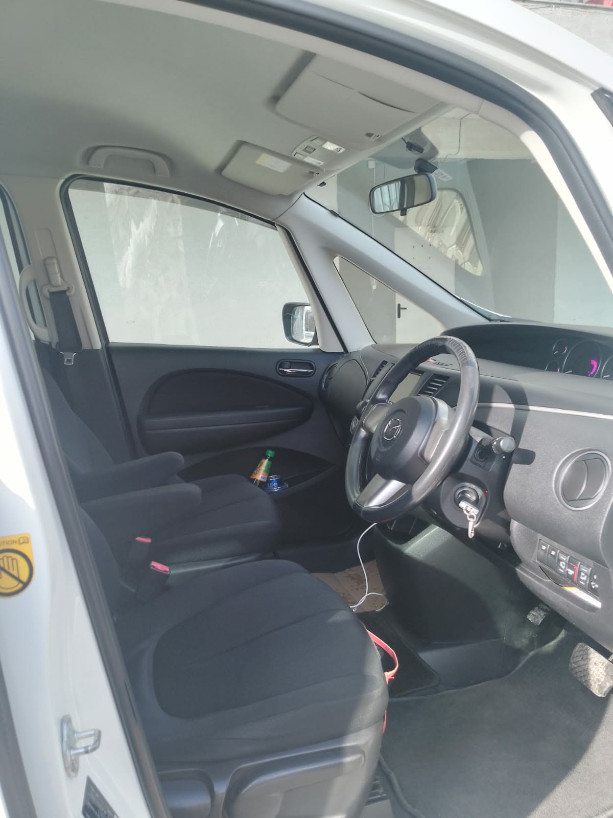 Front seats and dashboard of the Mazda minivan