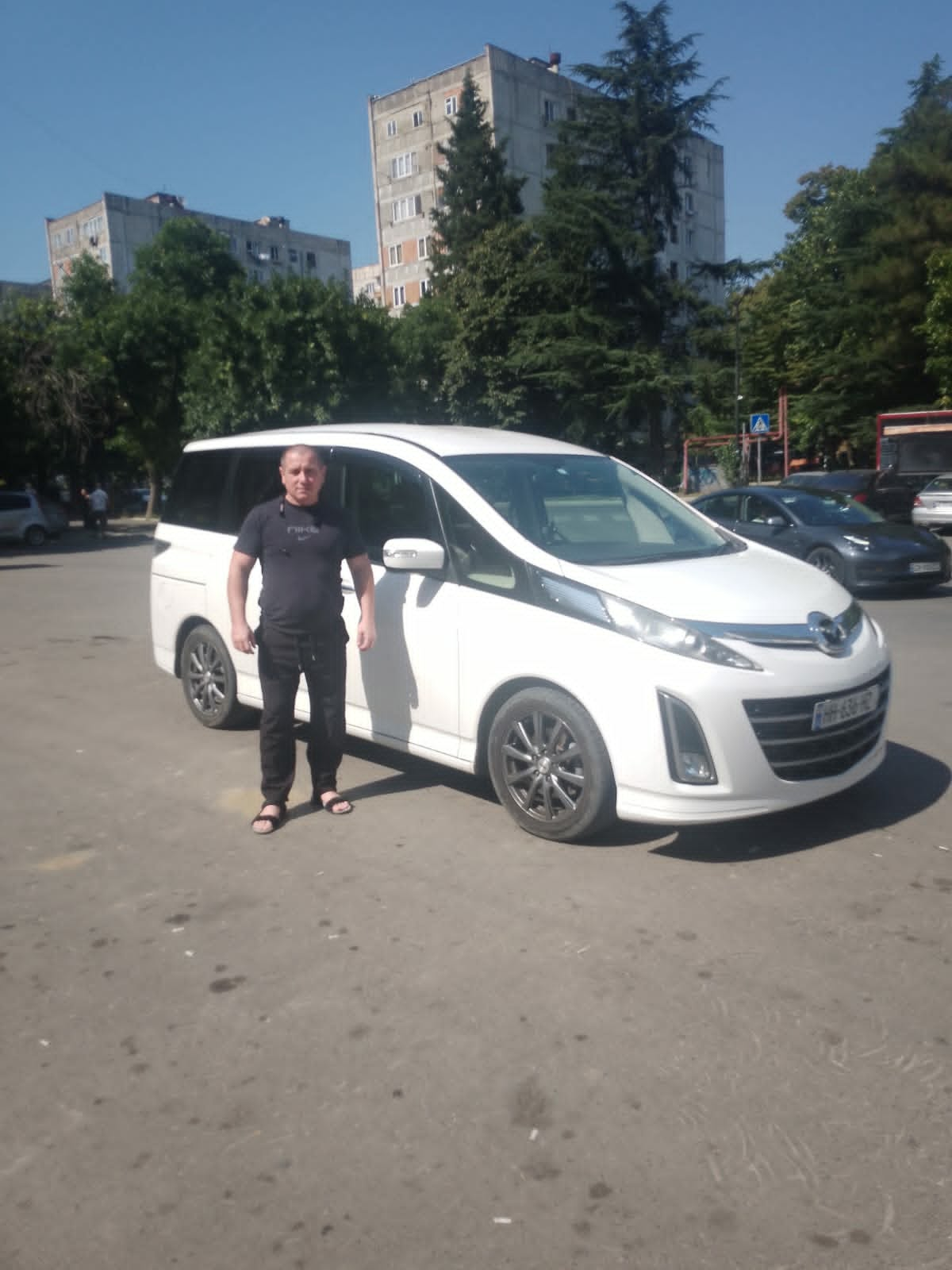 Your local Georgian driver and guide with his Mazda minivan